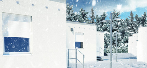 Small image of small houses while there is snowfalling